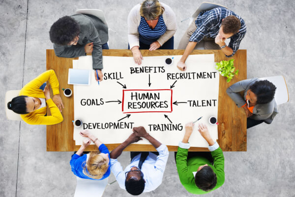 HR dept.sits down to discuss the inclusions in a HR PPT.