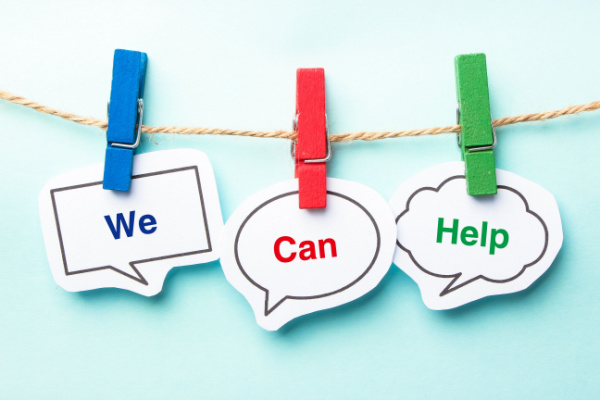 Image showing the sentence "We Can Help" hanging from clothespins.
