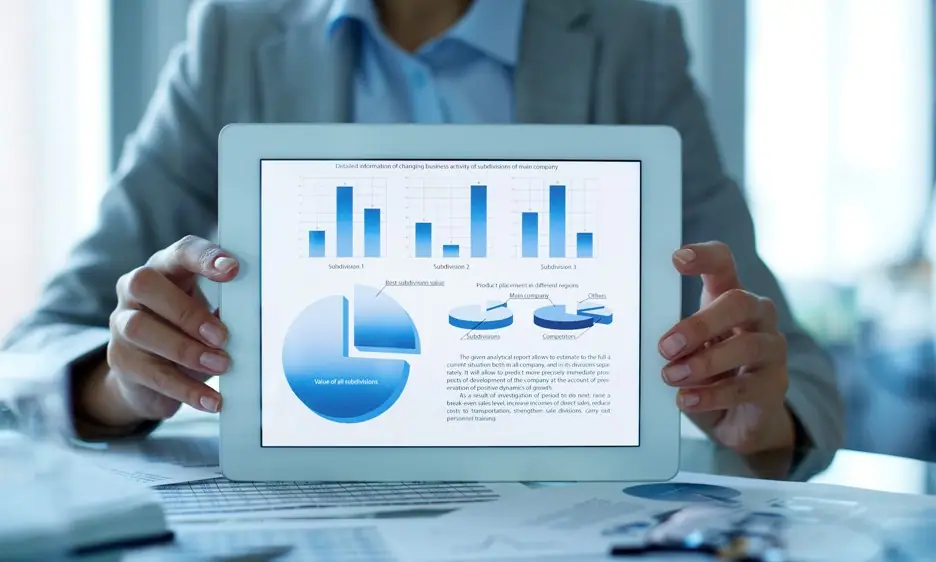 Hands holding up an example of company presentation design on an iPad.